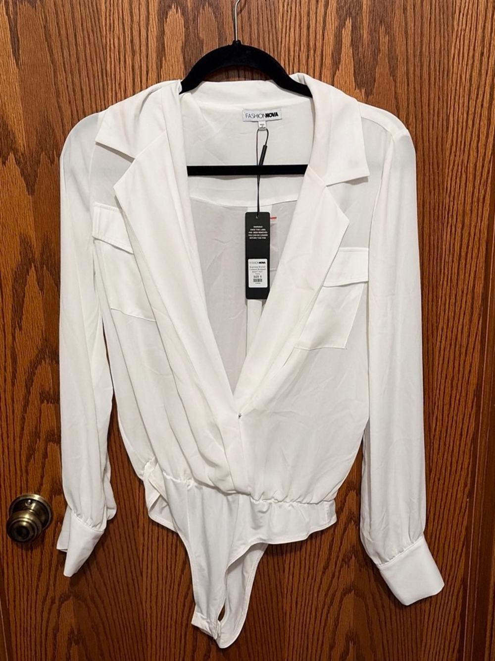 Fashion Nova White Long-Sleeve Surplice Bodysuit Top cut out front. Never worn